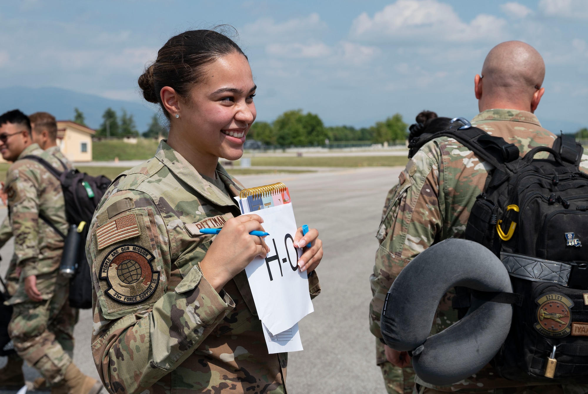 Airman holding sign