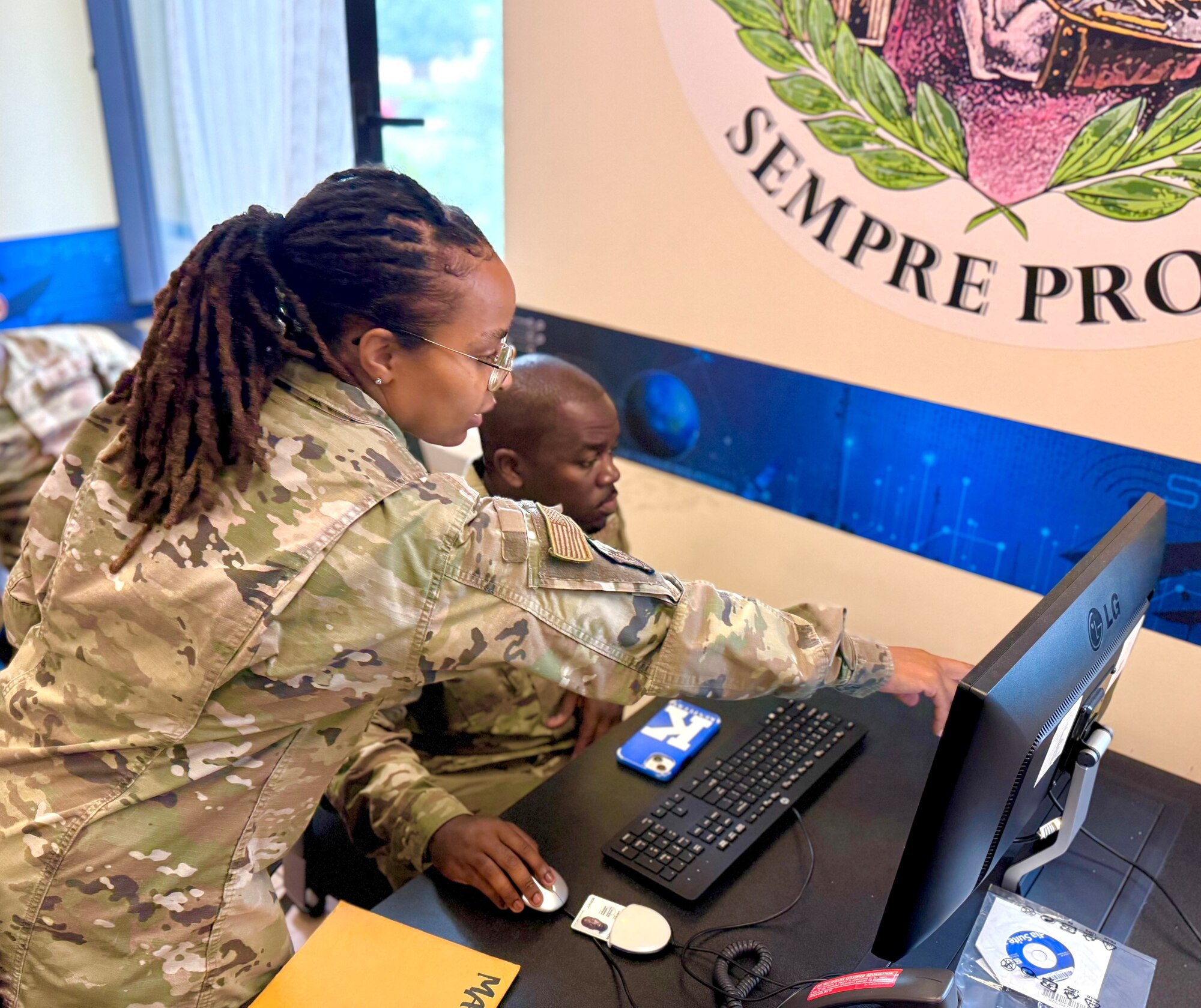 Airmen looking at computer