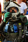 NAVAL STATION NORFOLK, July 17, 2025 – Navy Diver 2nd Class Austin Good, assigned to Explosive Ordnance Disposal Mobile Unit 6, performs surface checks on his KM-97 prior to diving on the amphibious assault ship USS Iwo Jima (LHD 7) while conducting underwater ship husbandry work with the Mid-Atlantic Regional Maintenance Center (MARMC) team. MARMC’s mission is essential to maintaining submarines, surface ships, and aircraft carriers through a series of complex underwater repairs and maintenance tasks, ensuring the fleet remains safe, ready, and mission-capable. (U.S. Navy photo by Mass Communication Specialist 2nd Class Imani Nave Bloodsaw)