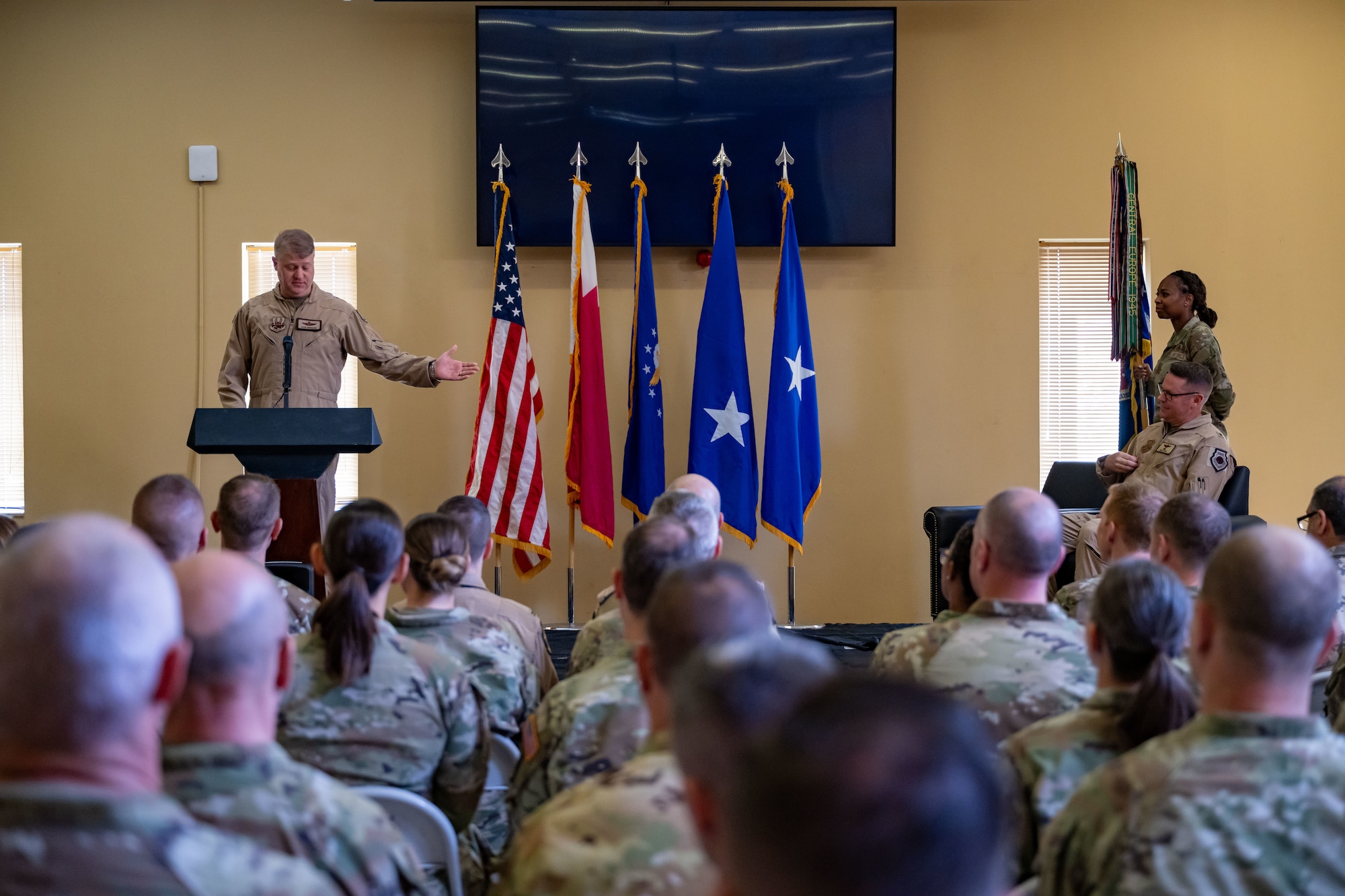 U.S. Air Force Maj. Gen. David Shoemaker, 9th Air Force (Air Forces Central) deputy commander, gives opening remarks during the 379th Air Expeditionary Wing Assumption of Command Ceremony within the U.S. Central Command area of responsibility, Sept. 12, 2025. The ceremony saw Brig. Gen. Daniel Clayton assume command of the largest wing in the AOR. (U.S. Air Force photo by Senior Airman Amanda Jett)