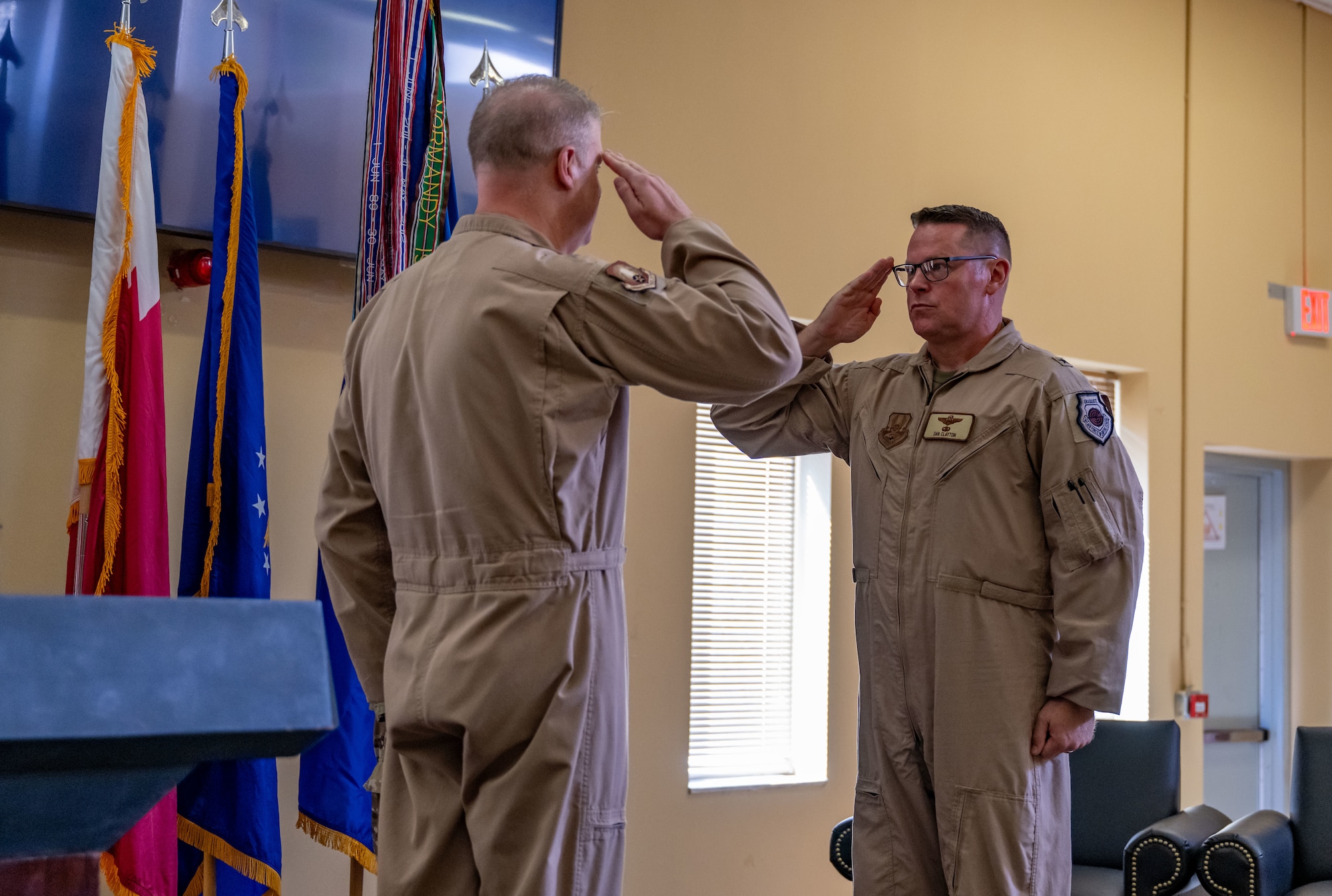 U.S. Air Force Brig. Gen. Daniel Clayton, right, 379th Air Expeditionary Wing incoming commander, renders a salute to Maj. Gen. David Shoemaker, 9th Air Force (Air Forces Central) deputy commander, during the 379th AEW Assumption of Command Ceremony within the U.S. Central Command area of responsibility, Sept. 12, 2025. The 379th AEW provides support to thousands of Air Force, joint and coalition force partners. (U.S. Air Force photo by Senior Airman Amanda Jett)