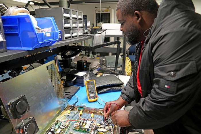 men working on electronics