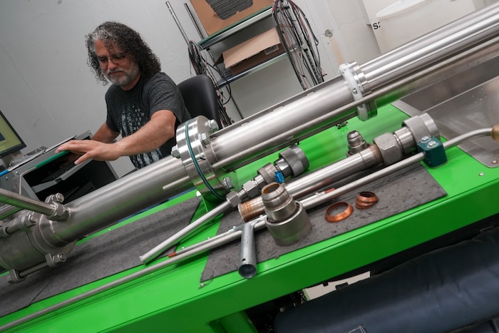 Man calibrates pipe