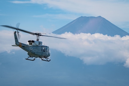 Helicopter flying towards mountain