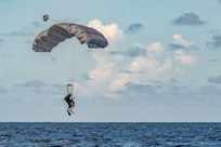 Airmen dropping into water
