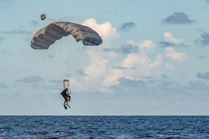 Airmen dropping into water