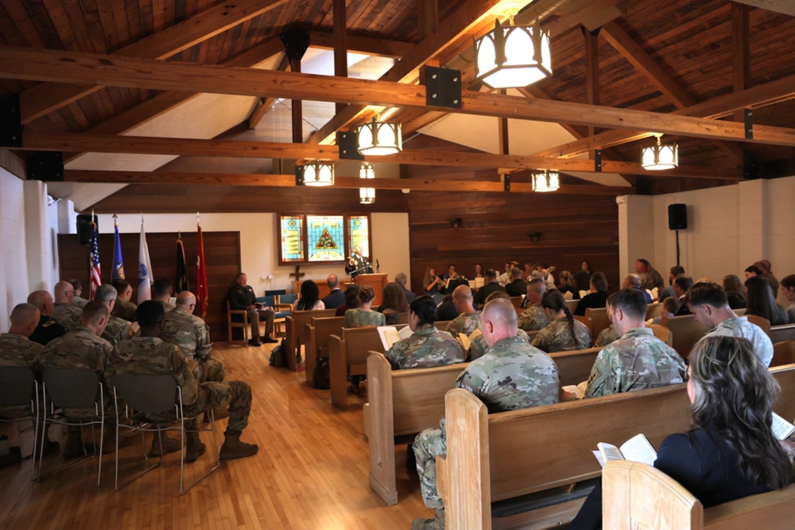 Wisconsin National Guard members, families and friends attend a dedicatory chapel service at the newly renovated Memorial Chapel on Camp Williams, near Camp Douglas, Wisconsin, Sept. 3, 2025. The service preceded the organization's first official change of stole ceremony during which U.S. Army Lt. Col. Jonathan Robertson replaced U.S. Army Col. Mark Brooks as the Wisconsin National Guard’s state chaplain. (U.S. National Guard photo by Isabella Jansen)