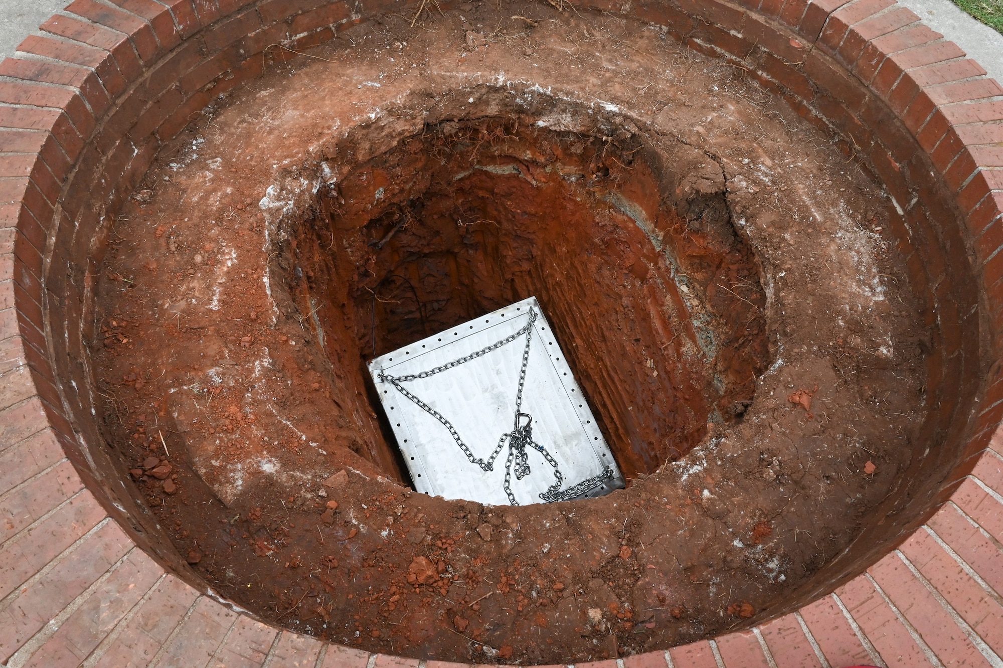 Military leadership burying a time capsule.