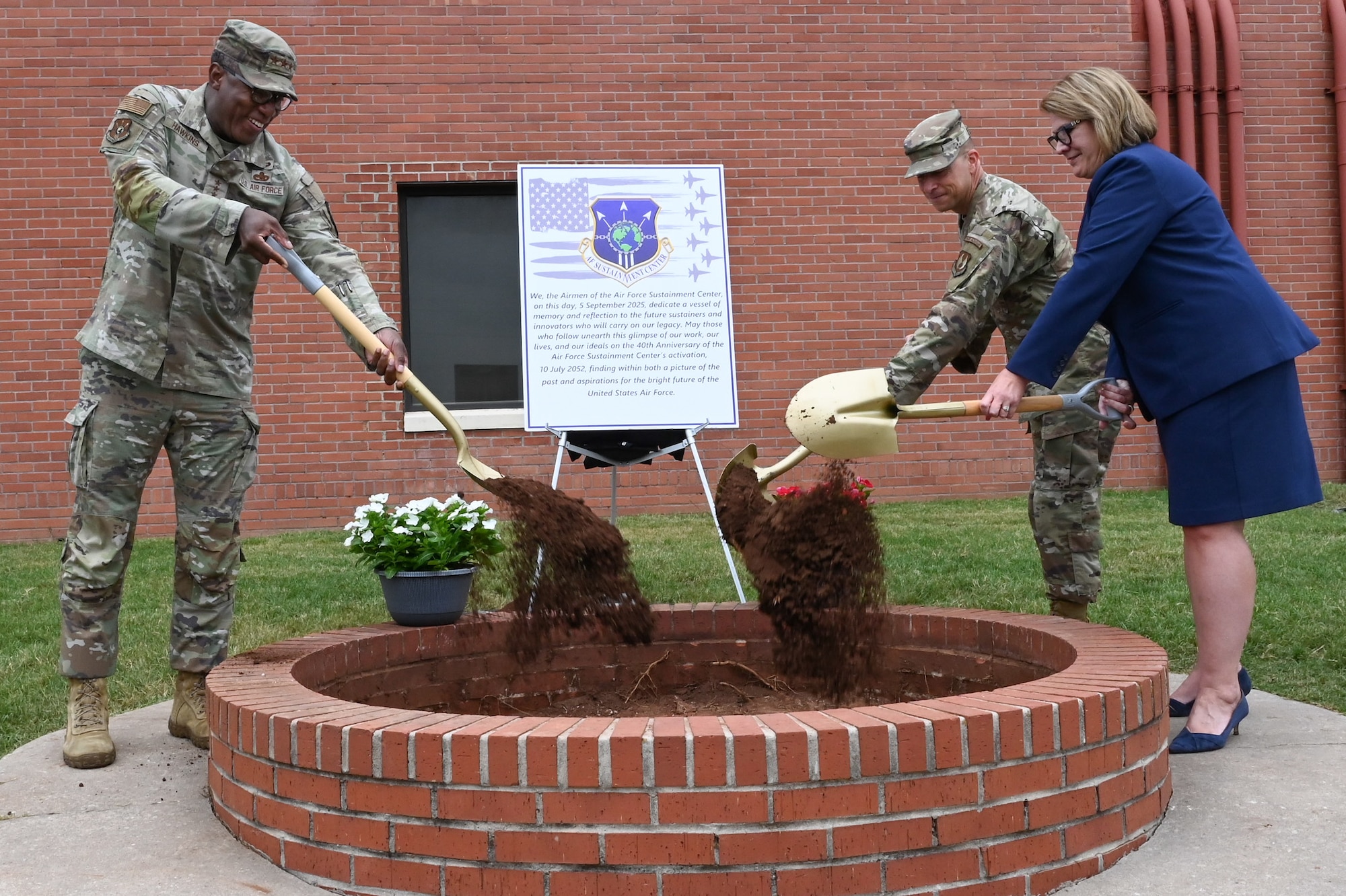 Military leadership burying a time capsule.