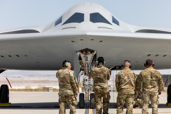 B-21 being inspected by Airmen.