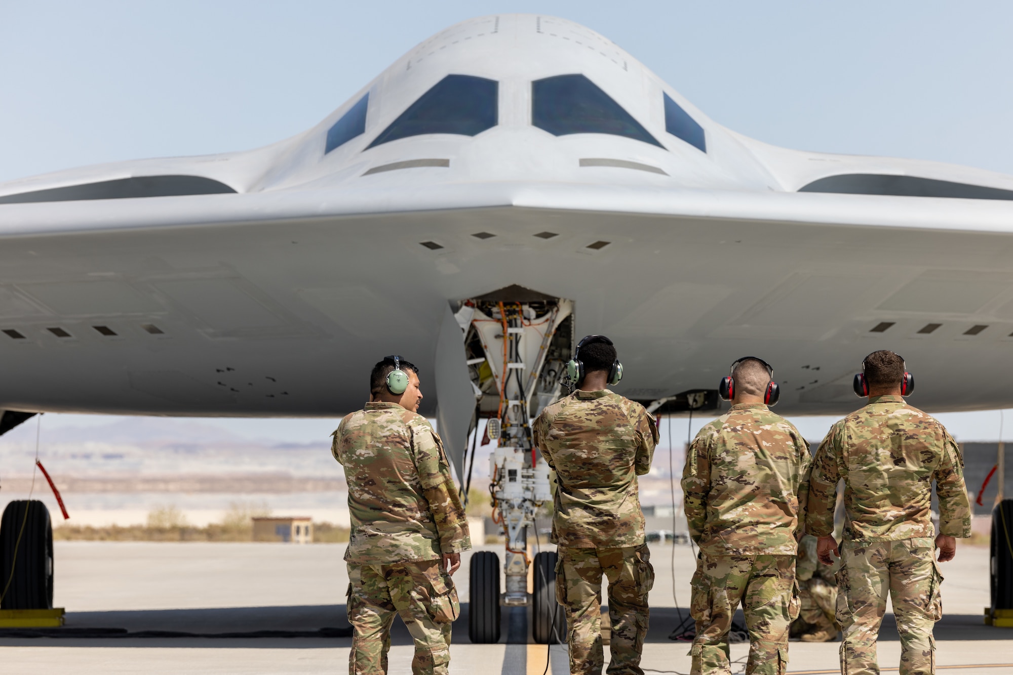 B-21 being inspected by Airmen.