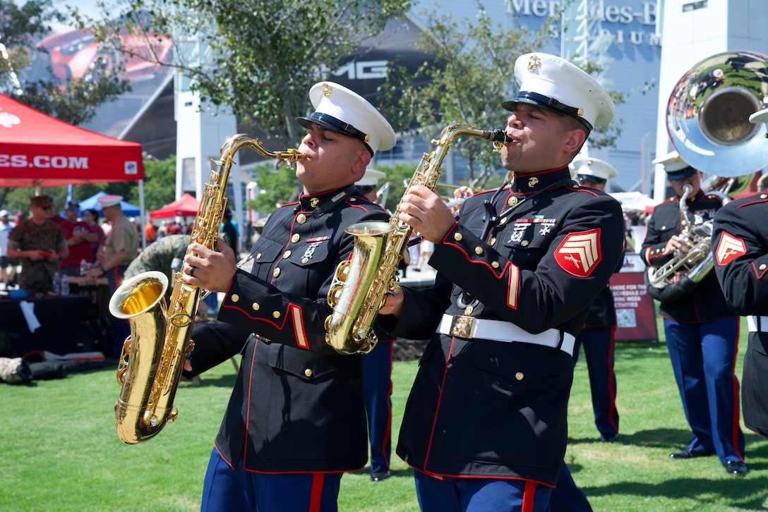 U.S. Marine Corps Sgt. Kenneth Valentine, (right) and Cpl. Daniel Melendez Baez, saxophone instrumentalists with the 2nd Marine Aircraft Wing Band, brass band, assigned to Special Purpose Marine Air-Ground Task Force-250 perform at the static display during Marine Week Atlanta, Aug. 31, 2025. Marines stationed across the globe commemorate the 250th anniversary of the Marine Corps, honoring a distinguished legacy of service, sacrifice, and unwavering fidelity to both the nation and the Corps. (U.S. Marine Corps photo by Staff Sgt. Matthew Booth)