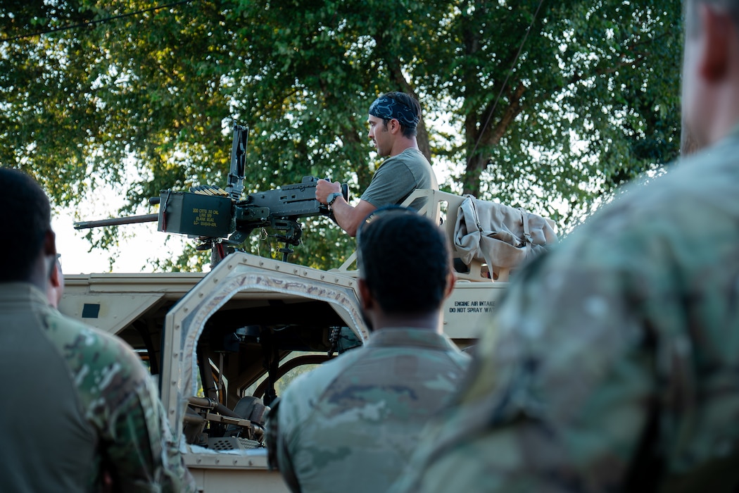 U.S. Soldiers assigned to 3rd Special Forces Group (Airborne), alongside Airman security forces with Air National Guard (ANG), and 824th Base Defense Squadron participate in a sand table brief during Sage Eagle exercise 25-4 on Fort A.P. Hill, Virginia, August 30, 2025. Every year, Sage Eagle exercise tests the agility, precision, and combat readiness of 3rd Special Forces Group (Airborne) Soldiers alongside partner forces as they prepare to face the challenges of real-world missions. (U.S. Army photo taken by Sgt. Edward Randolph)