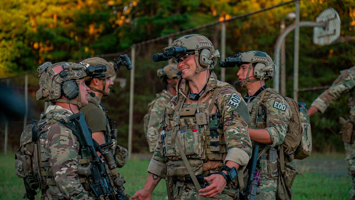 U.S. Soldiers assigned to 3rd Special Forces Group (Airborne), alongside Airman security forces with Air National Guard (ANG), and 824th Base Defense Squadron participate in a sand table brief during Sage Eagle exercise 25-4 on Fort A.P. Hill, Virginia, August 30, 2025. Every year, Sage Eagle exercise tests the agility, precision, and combat readiness of 3rd Special Forces Group (Airborne) Soldiers alongside partner forces as they prepare to face the challenges of real-world missions. (U.S. Army photo taken by Sgt. Edward Randolph)