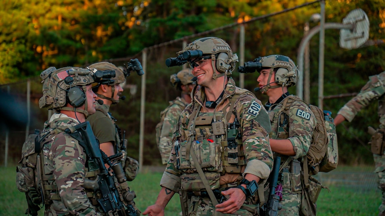U.S. Soldiers assigned to 3rd Special Forces Group (Airborne), alongside Airman security forces with Air National Guard (ANG), and 824th Base Defense Squadron participate in a sand table brief during Sage Eagle exercise 25-4 on Fort A.P. Hill, Virginia, August 30, 2025. Every year, Sage Eagle exercise tests the agility, precision, and combat readiness of 3rd Special Forces Group (Airborne) Soldiers alongside partner forces as they prepare to face the challenges of real-world missions. (U.S. Army photo taken by Sgt. Edward Randolph)