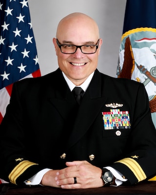 RDML Van Poots, bio photo