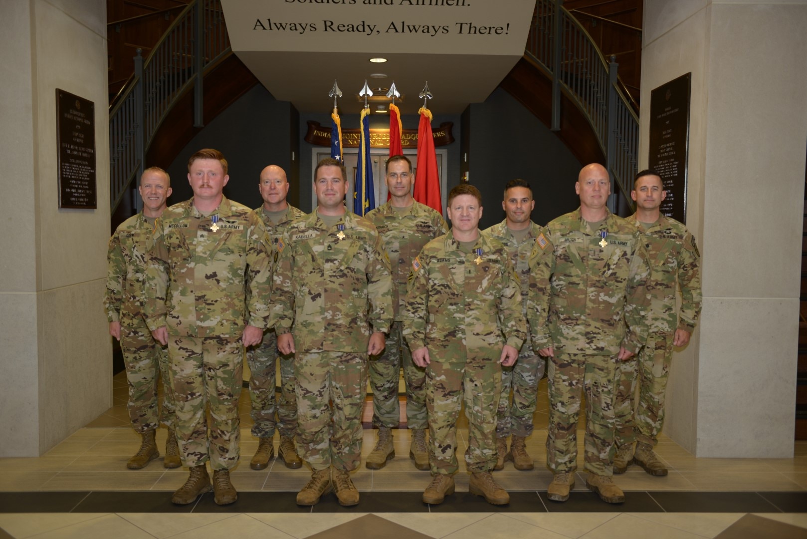 Indiana National Guard leadership poses with front from left, Chief Warrant Officer 4 Brett Milton, Chief Warrant Officer 3 Craig Adams, Sgt. 1st Class Adam Kabella and Sgt. Dalton McCollum, are recognized for their heroism during a ceremony at Stout Field in Indianapolis, Friday, Sept. 12, 2025.