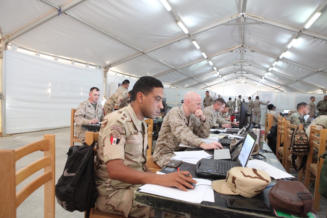 Egyptian armed forces service members working shoulder-to-shoulder with U.S. Marines during Exercise BRIGHT STAR 25’s Command Post Exercise, Mohamed Naguib Military Base (MNMB), Egypt, Sept. 7, 2025. Bright Star 25 is a multilateral U.S. Central Command (USCENTCOM) command-post exercise, held in the Arab Republic of Egypt along with other partner nations. The exercise enhances regional security and stability by responding to modern day security scenarios. (U.S. Central Command photo by Maged Benjamin-Elias)