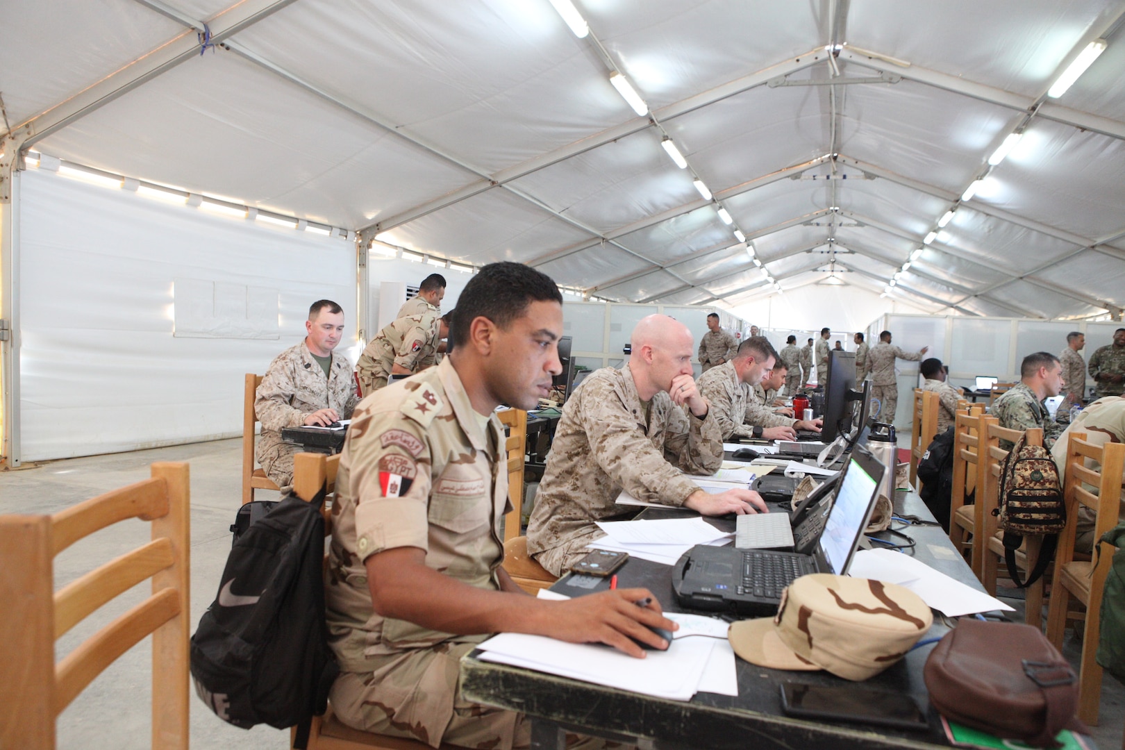 Egyptian armed forces service members working shoulder-to-shoulder with U.S. Marines during Exercise BRIGHT STAR 25’s Command Post Exercise, Mohamed Naguib Military Base (MNMB), Egypt, Sept. 7, 2025. Bright Star 25 is a multilateral U.S. Central Command (USCENTCOM) command-post exercise, held in the Arab Republic of Egypt along with other partner nations. The exercise enhances regional security and stability by responding to modern day security scenarios. (U.S. Central Command photo by Maged Benjamin-Elias)