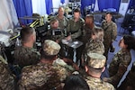 ERSS 9 team members Lt. j.g. Erin Moore, Lt. Cmdr. Brent Buccine, CDR Jacob Adam’s, and CDR John Maddox demonstrate role 2 trauma and assessment capabilities during Operation Bright Star 25, Mohamed Najuib Military Base, Egypt, Sep. 4, 2025. The BRIGHT STAR exercise enhances readiness and builds our partners’ capacity to operate seamlessly together, while improving interoperability in a joint operations environment. (U.S. Central Command photo by Maged Benjamin-Elias)
