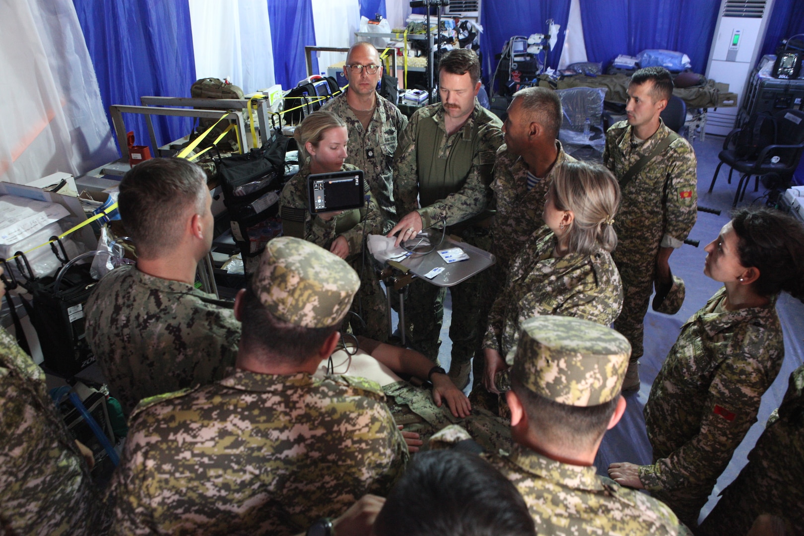 ERSS 9 team members Lt. j.g. Erin Moore, Lt. Cmdr. Brent Buccine, CDR Jacob Adam’s, and CDR John Maddox demonstrate role 2 trauma and assessment capabilities during Operation Bright Star 25, Mohamed Najuib Military Base, Egypt, Sep. 4, 2025. The BRIGHT STAR exercise enhances readiness and builds our partners’ capacity to operate seamlessly together, while improving interoperability in a joint operations environment. (U.S. Central Command photo by Maged Benjamin-Elias)