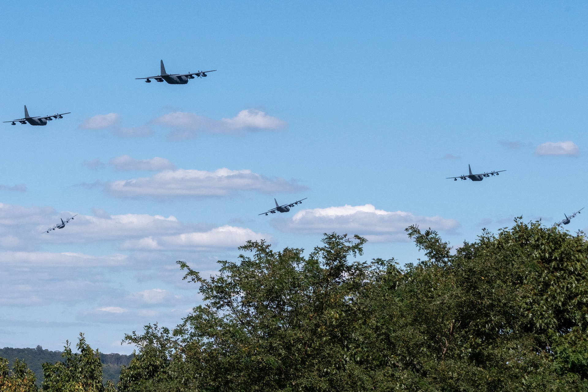 The Pennsylvania Air National Guard’s 193rd Special Operations Wing conducts a 6-aircraft training flight, to honor the memory of the nearly 3,000 innocent victims who died in the Sept. 11 terrorist attacks, and the first responders who risked their own lives to save others. This flight of MC-130J Commando II aircraft showcases the resiliency of the American Spirit by flying a mass formation, low-altitude training flight that is visible throughout the greater Central Pennsylvania area. A portion of the flight path includes Fort Indiantown Gap. (Pennsylvania National Guard photo by Wayne V. Hall)