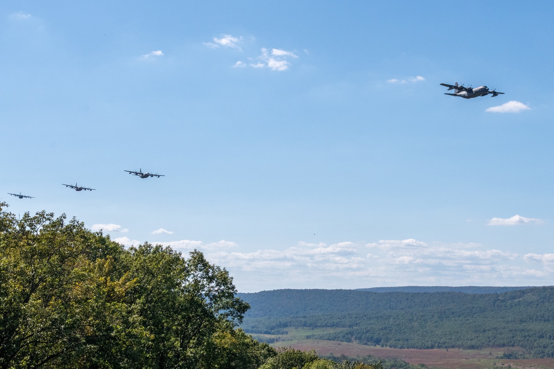 The Pennsylvania Air National Guard’s 193rd Special Operations Wing conducts a 6-aircraft training flight, to honor the memory of the nearly 3,000 innocent victims who died in the Sept. 11 terrorist attacks, and the first responders who risked their own lives to save others. This flight of MC-130J Commando II aircraft showcases the resiliency of the American Spirit by flying a mass formation, low-altitude training flight that is visible throughout the greater Central Pennsylvania area. A portion of the flight path includes Fort Indiantown Gap. (Pennsylvania National Guard photo by Wayne V. Hall)