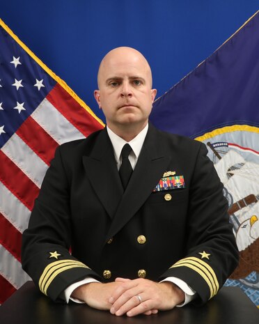 Cmdr. RYAN J. SISLER