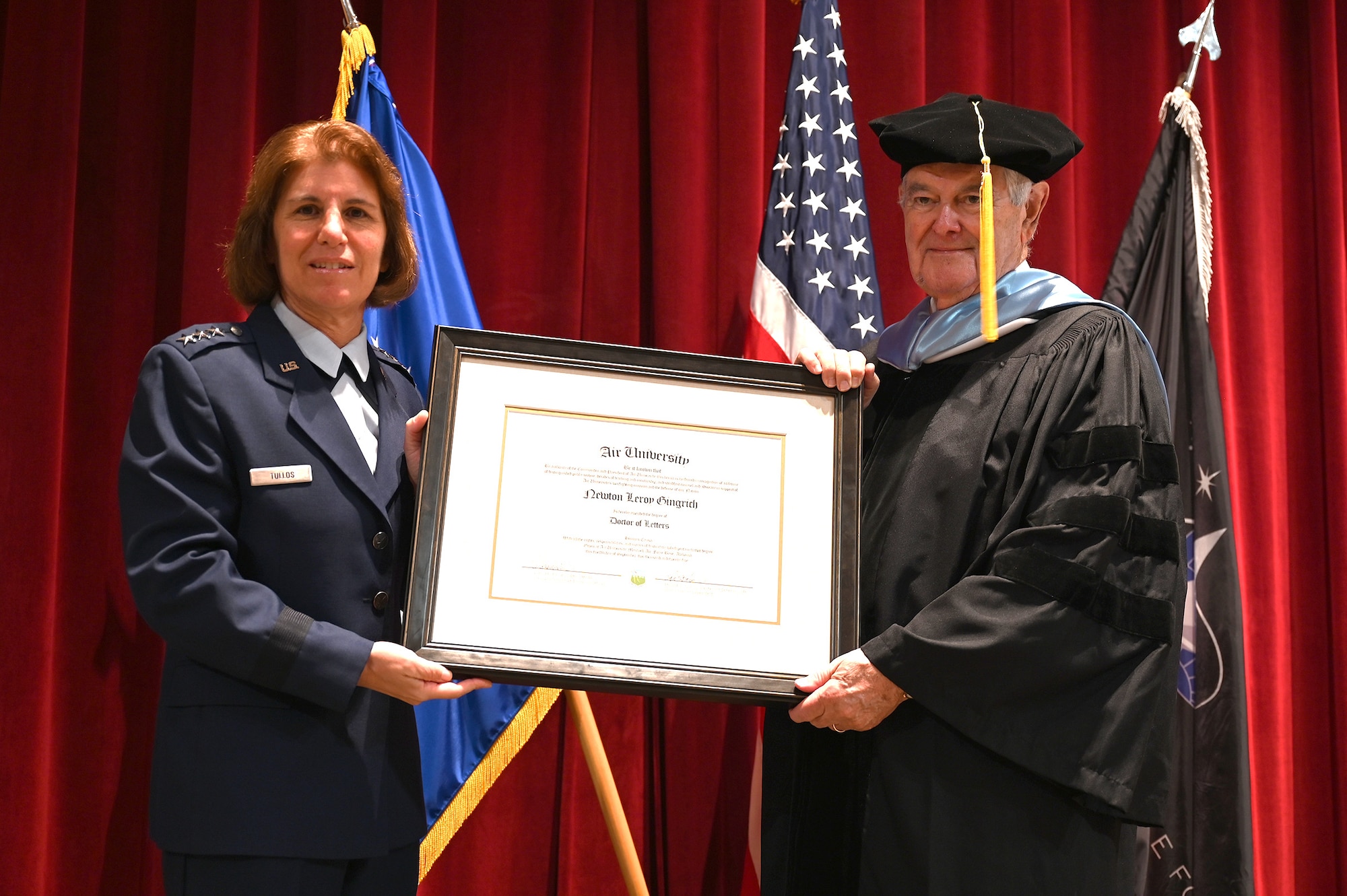 U.S. Air Force Lt. Gen. Andrea D. Tullos, Air University commander and president, awarded an honorary doctorate from Air University to Newt Gingrich,