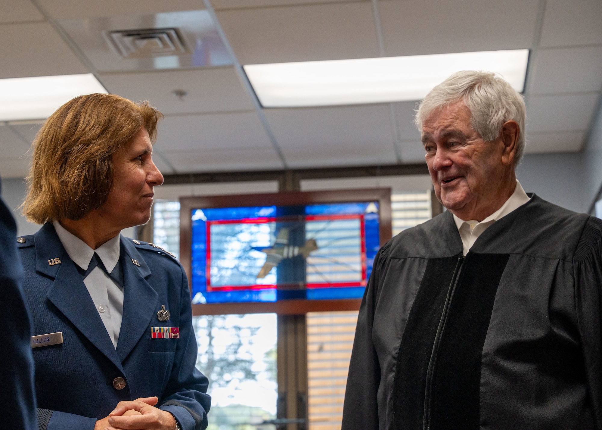 Lt. Gen. Andrea Tullos, commander and president, Air University, speaks with Newt Gingrich, Former Speaker of the House at Maxwell Air Force Base, Alabama