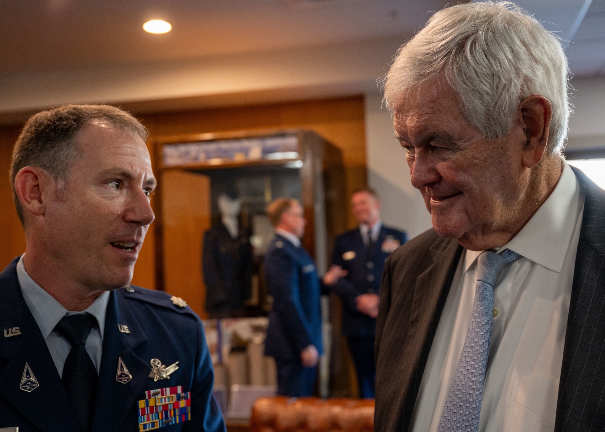 Newt Gingrich, Former Speaker of the House, interacts with Servicemembers attending his honorary doctorate ceremony at Maxwell Air Force Base, Alabama
