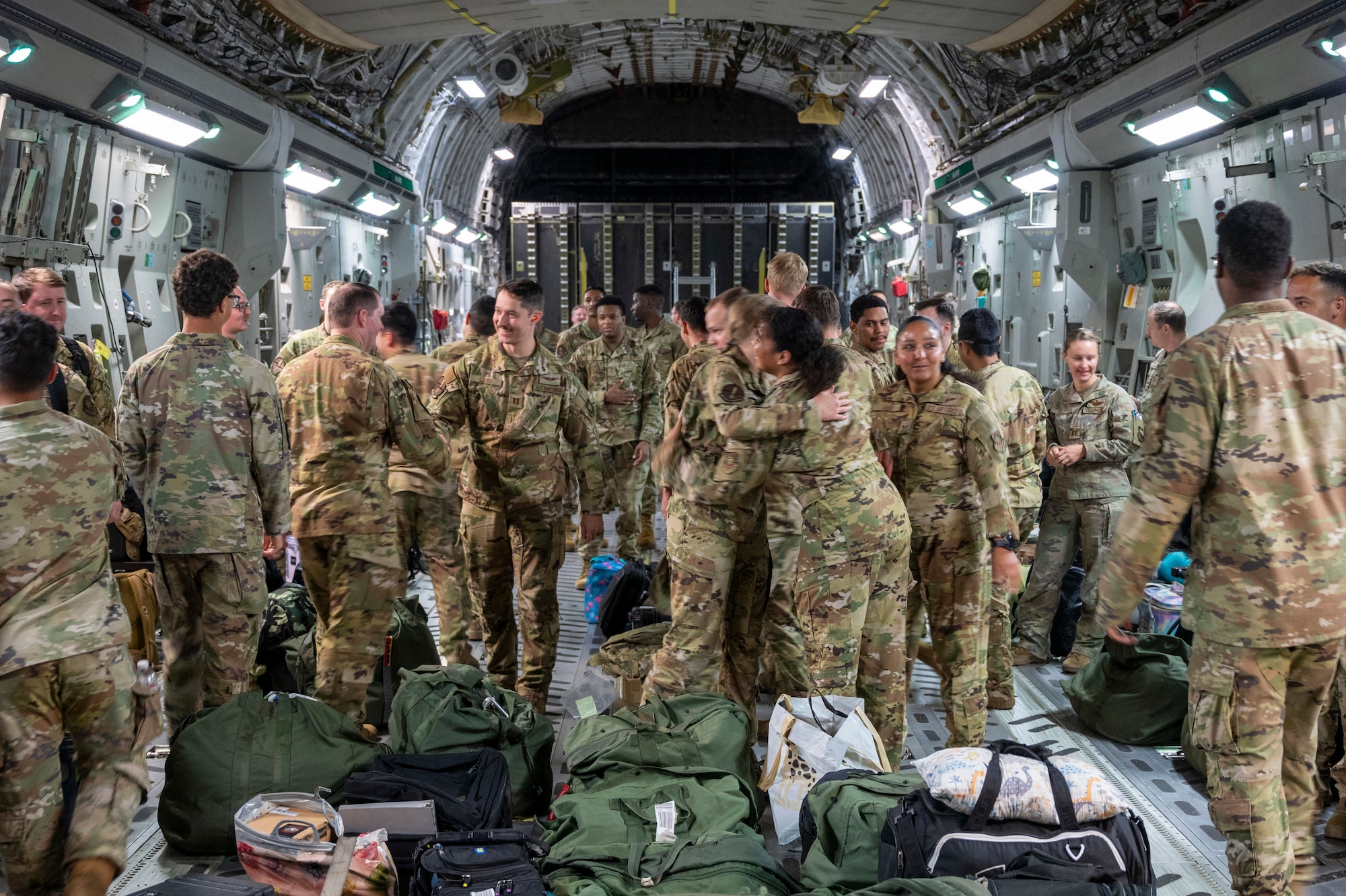 Team McChord Airmen reconnect during the 7th Expeditionary Airlift Squadron’s redeployment to Joint Base Lewis-McChord, Washington, Sept. 7, 2025.
