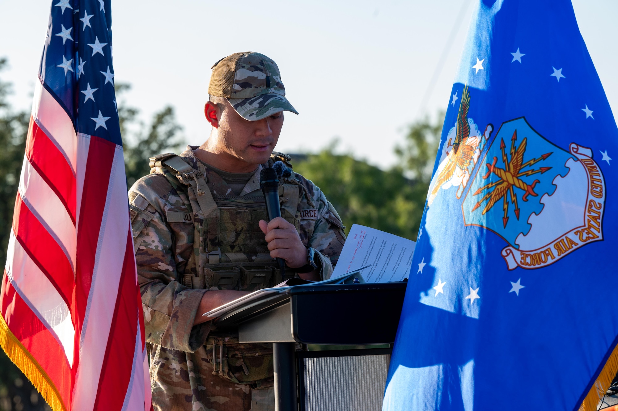 U.S. Air Force 1st Lt. Joseph Jun, 7th Bomb Wing chaplain, leads a prayer during a 9/11 memorial at Dyess Air Force Base, Texas, Sept. 11, 2025. The memorial served as a reminder of the sacrifices made by first responders, members of the armed forces and community members in the days and years that followed the attacks on September 11, 2001. (U.S. Air Force photo by Airman 1st Class Adrien Tran)
