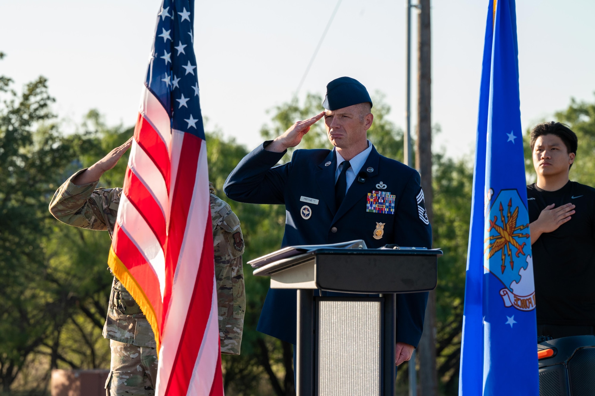 U.S. Air Force Chief Master Sgt. William Pritchett, 7th Civil Engineer Squadron fire chief, salutes during a 9/11 memorial at Dyess Air Force Base, Texas, Sept. 11, 2025. The memorial served as a reminder of the sacrifices made by first responders, members of the armed forces and community members in the days and years that followed the attacks on September 11, 2001. (U.S. Air Force photo by Airman 1st Class Adrien Tran)