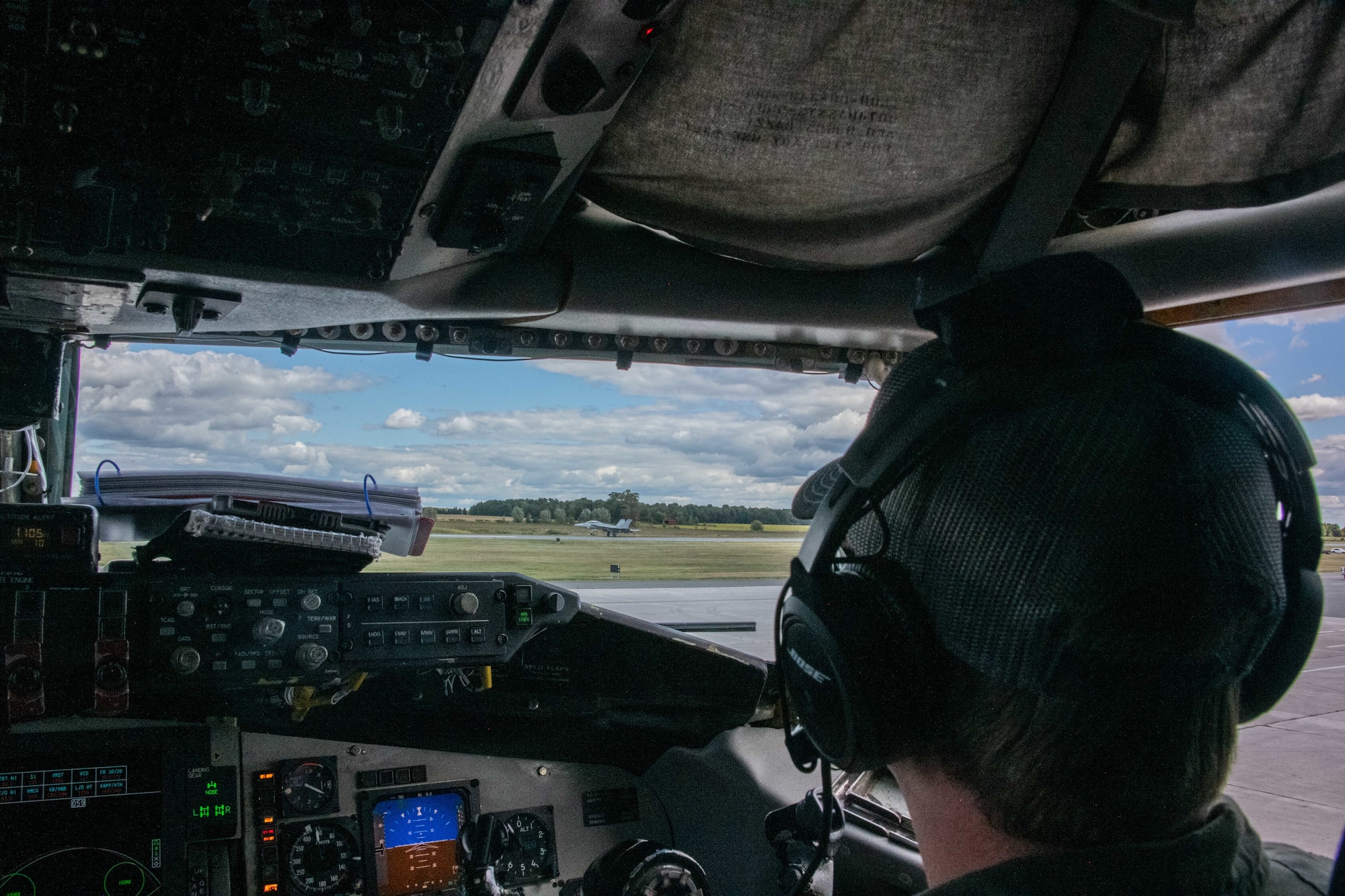 a person watches a jet takeoff