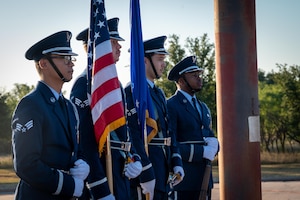 The Dyess Honor Guard presents the colors during a 9/11 memorial at Dyess Air Force Base, Texas, Sept. 11, 2025. Through remembrance, Dyess reaffirmed its commitment to carrying forward the legacy of courage and service inspired by the 9/11 first responders. (U.S. Air Force photo by Airman 1st Class Adrien Tran)