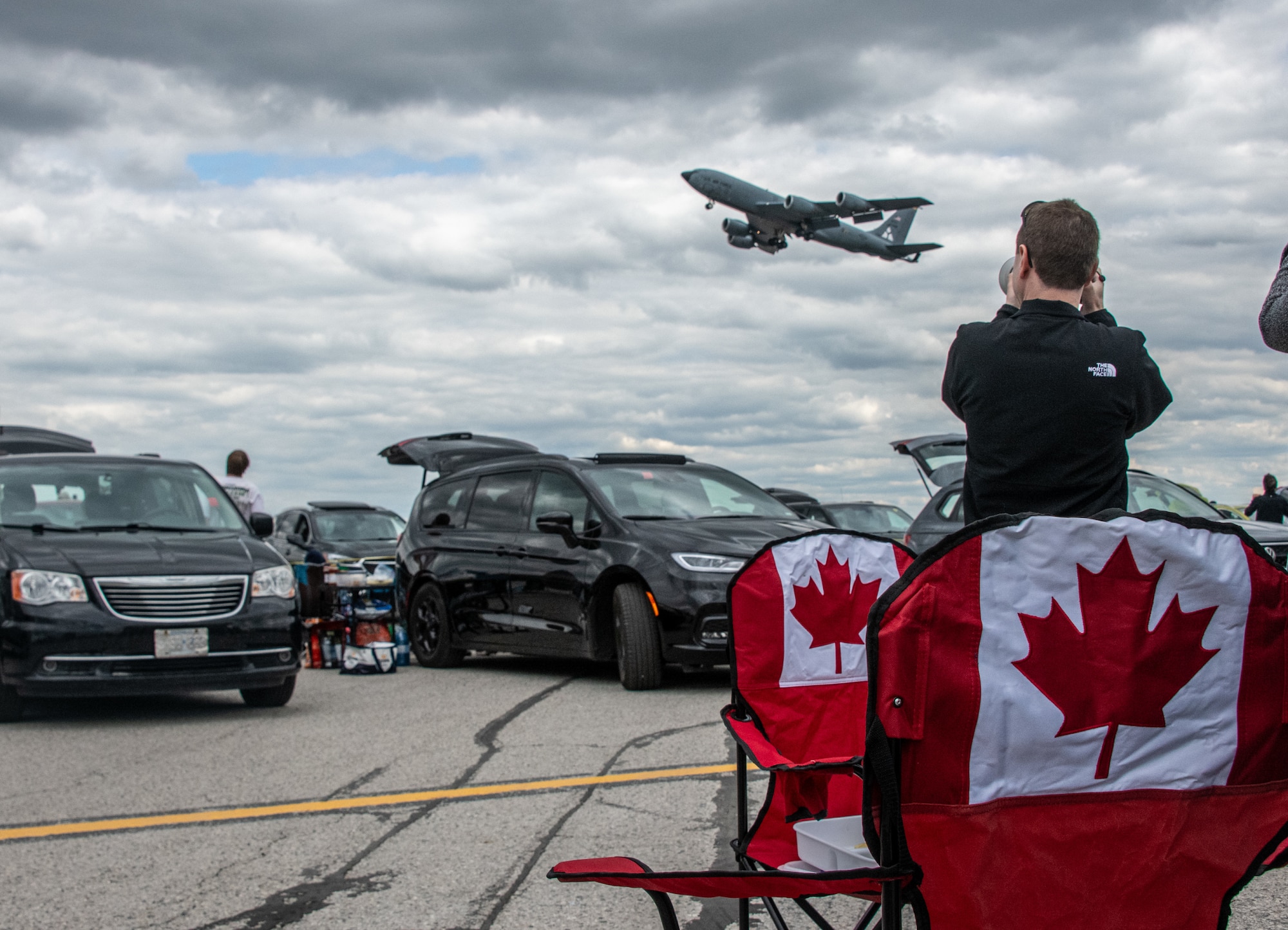 people look at an aircraft flyover