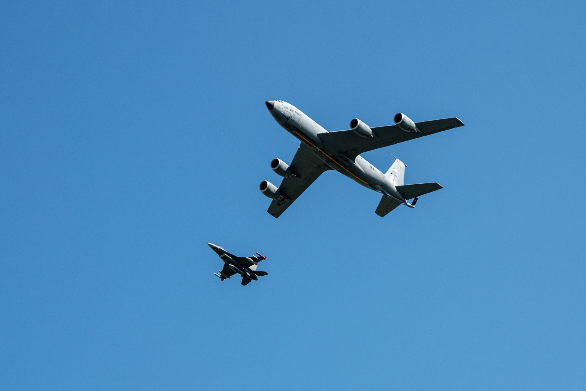 two aircraft fly next to each other