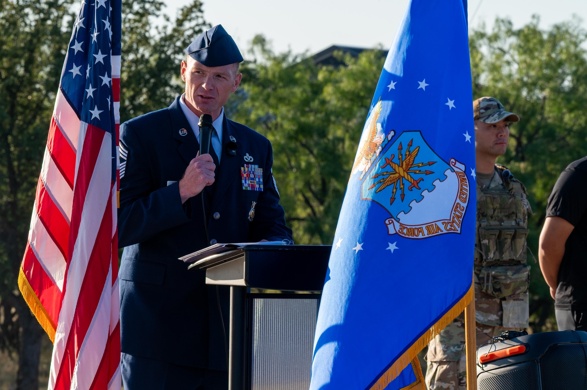 U.S. Air Force Chief Master Sgt. William Pritchett, 7th Civil Engineer Squadron fire chief, speaks during a 9/11 memorial at Dyess Air Force Base, Texas, Sept. 11, 2025. The memorial served as a reminder of the sacrifices made by first responders, members of the armed forces and community members in the days and years that followed the attacks on September 11, 2001. (U.S. Air Force photo by Airman 1st Class Adrien Tran)