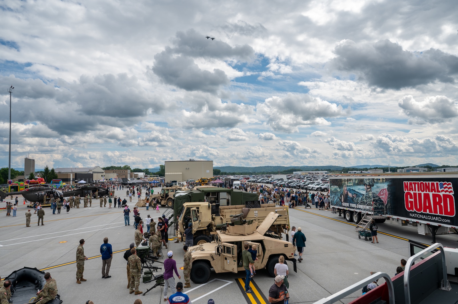 Photo of More than 6,000 visitors exploring the Vermont National Guard Open House at the Vermont Air National Guard Base, South Burlington, Vermont, Sept 7, 2005. This event allows guests to meet National Guardsmen, learn more about military and civilian aviation, watch multiple demonstrations, and enjoy walking through the STEM and job fairs hosted by our community partners