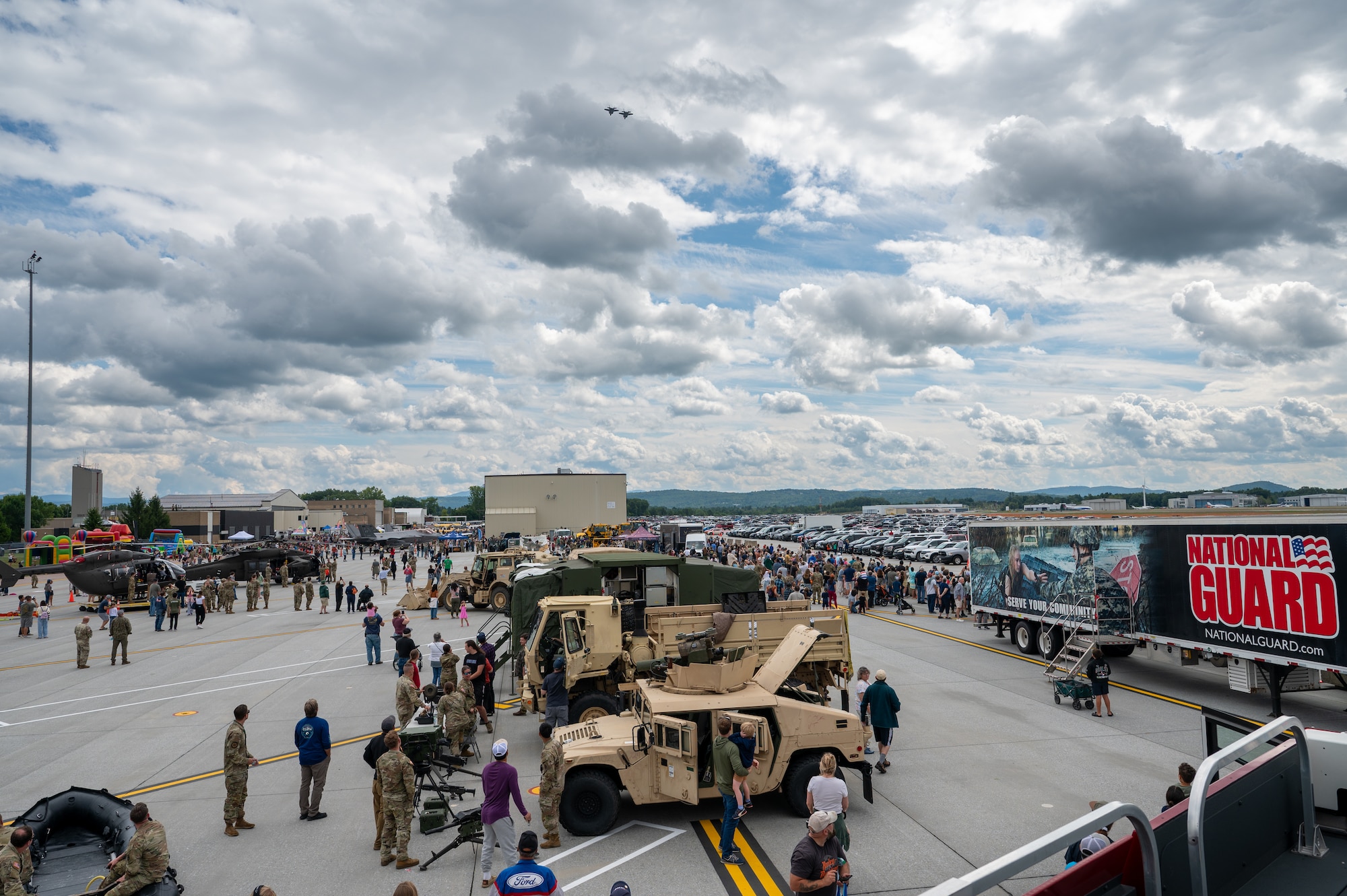Photo of More than 6,000 visitors exploring the Vermont National Guard Open House at the Vermont Air National Guard Base, South Burlington, Vermont, Sept 7, 2005. This event allows guests to meet National Guardsmen, learn more about military and civilian aviation, watch multiple demonstrations, and enjoy walking through the STEM and job fairs hosted by our community partners