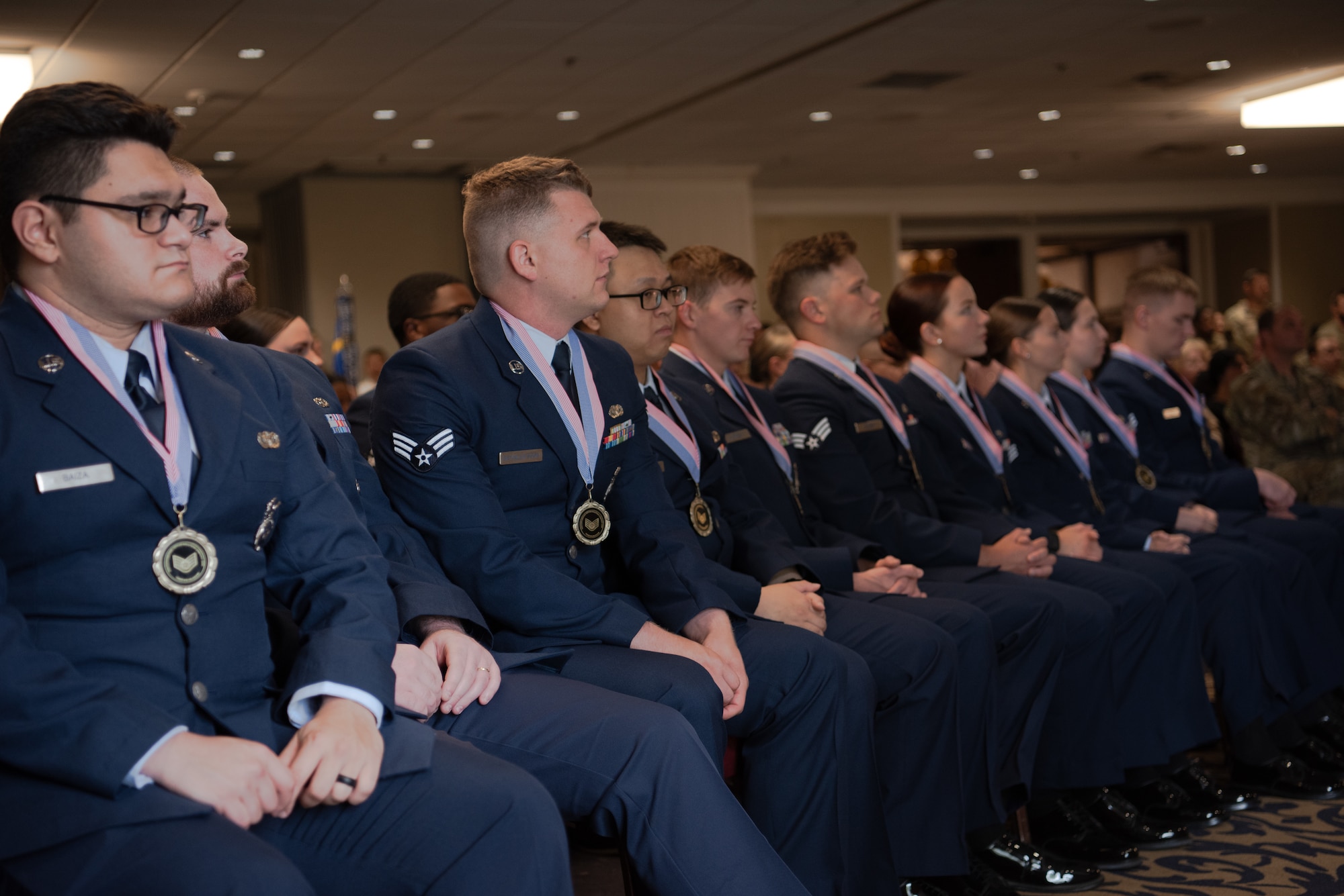Air Force members sit in line