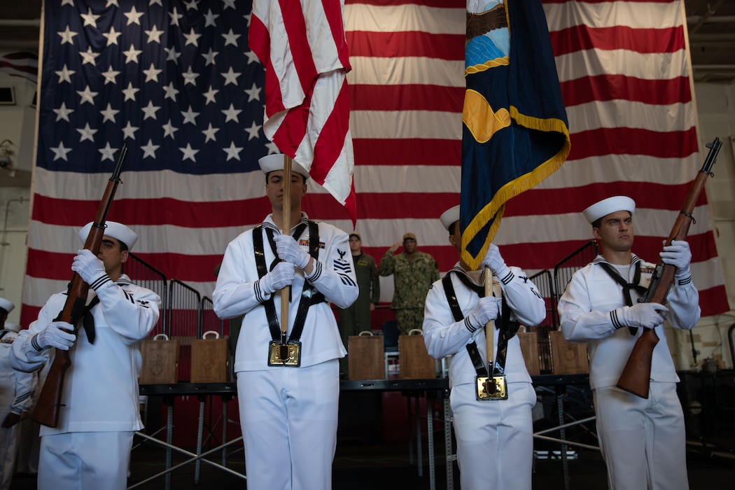 Sailors perform color guard duties during a Sept. 11 memorial service aboard Nimitz-class aircraft carrier USS George Washington (CVN 73) while moored pierside at Commander, Fleet Activities Yokosuka, Sept.  11, 2025.