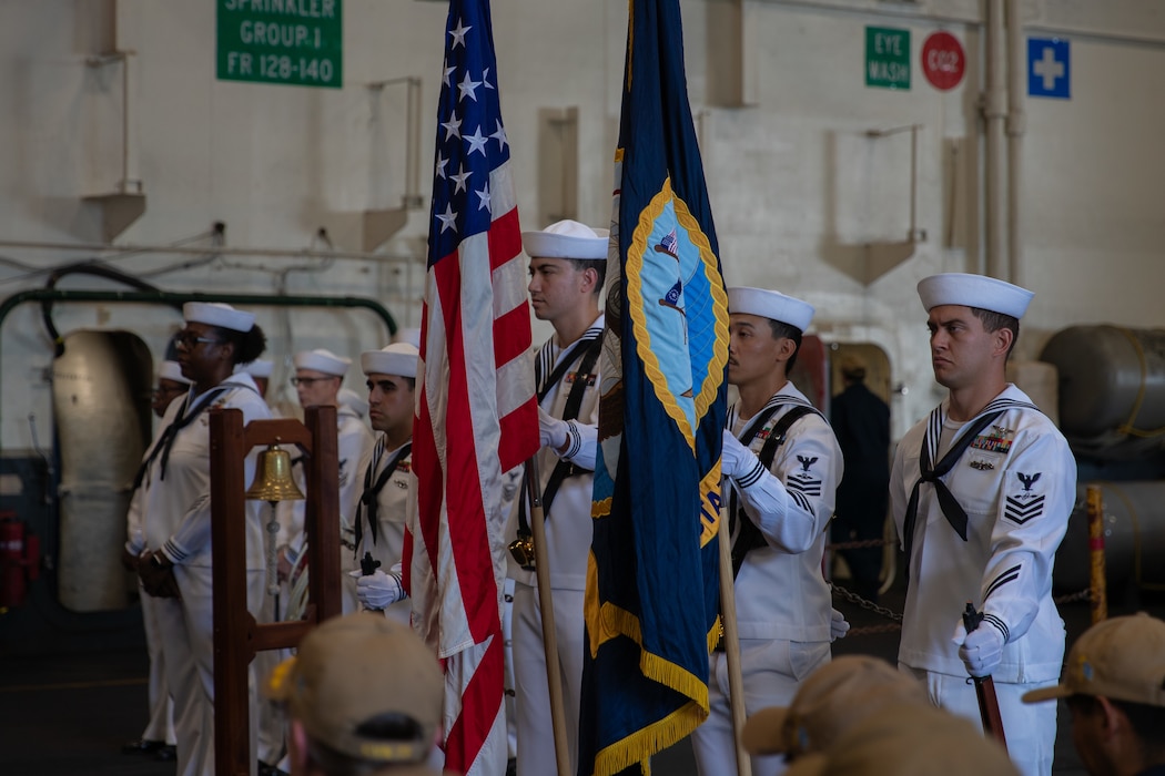 Sailors perform color guard duties during a Sept. 11 memorial service aboard Nimitz-class aircraft carrier USS George Washington (CVN 73) while moored pierside at Commander, Fleet Activities Yokosuka, Sept.  11, 2025.