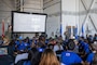Students from across Oahu listen to a brief by U.S. Air Force pilots on the C-17 Globemaster III.