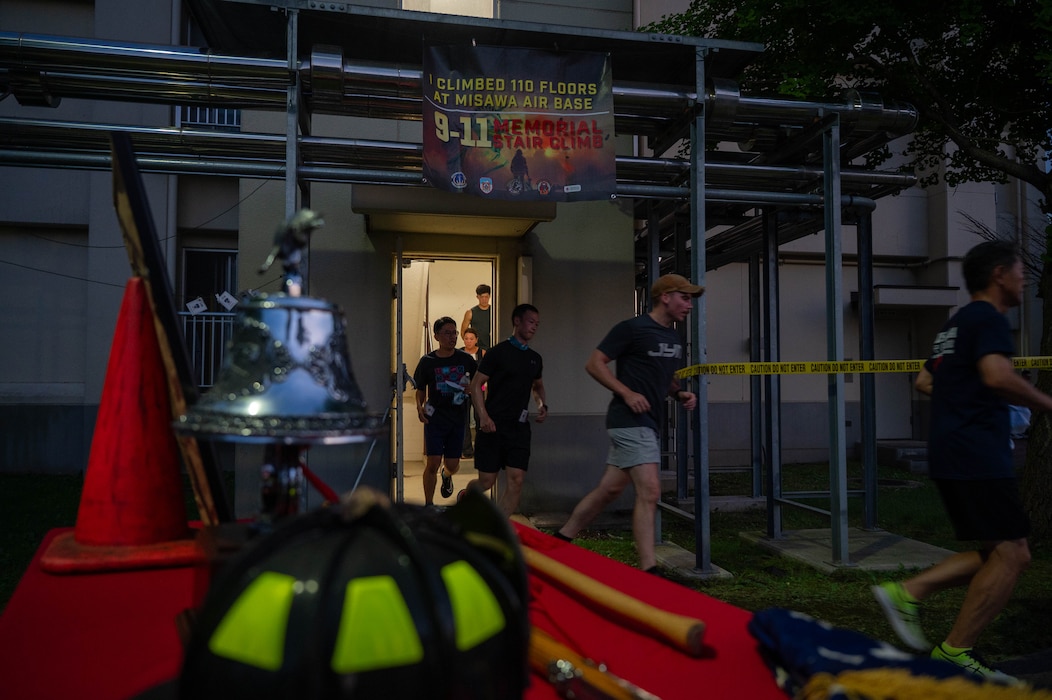 Participants of the 9/11 remembrance stair climb complete a lap at Misawa Air base, Japan. Sept 11, 2025.