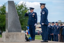 U.S. Air Force Col. Paul Davidson, 35th Fighter Wing commander, left, and Master Sergeant Daniel Garcia, 35th Civil Engineer Squadron firefighter, right, lay down a wreath in remembrance during a 9/11 ceremony at Misawa Air Base, Japan, Sept. 11, 2025.