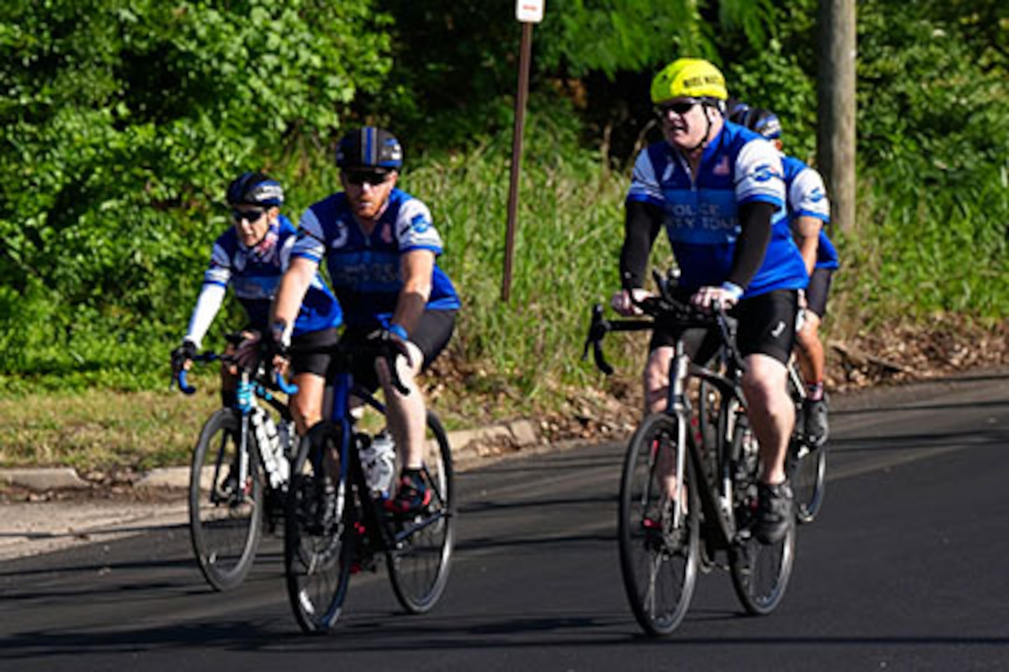 Photo of people biking on road.
