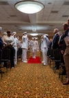 NAVAL STATION NORFOLK (Sept. 12, 2025) – Commander, Navy Region Mid-Atlantic, Rear Adm. Carl Lahti, passes through sideboys during a change of command and retirement ceremony, held at Vista Point onboard Naval Station Norfolk, Sept. 12. CNRMA is the regional coordinator for all shore-based naval personnel and shore activities in the Mid-Atlantic region, which encompasses 20 states, 13 installations, and numerous Navy reserve centers from Maine to Virginia and as far west as Illinois. (U.S. Navy photo by Mass Communication Specialist 1st Class 1st Class Kirk T. Putnam)