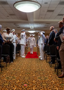 NAVAL STATION NORFOLK (Sept. 12, 2025) – Commander, Navy Region Mid-Atlantic, Rear Adm. Carl Lahti, passes through sideboys during a change of command and retirement ceremony, held at Vista Point onboard Naval Station Norfolk, Sept. 12. CNRMA is the regional coordinator for all shore-based naval personnel and shore activities in the Mid-Atlantic region, which encompasses 20 states, 13 installations, and numerous Navy reserve centers from Maine to Virginia and as far west as Illinois. (U.S. Navy photo by Mass Communication Specialist 1st Class 1st Class Kirk T. Putnam)